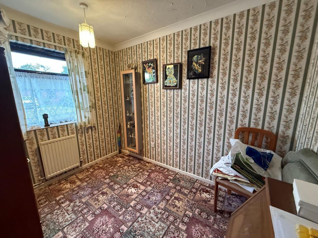 Carpeted bedroom with window