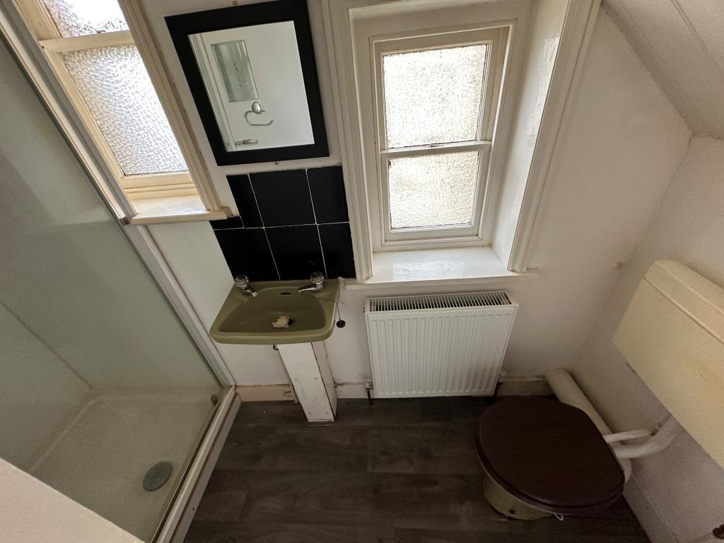 Bathroom with shower, basin and WC