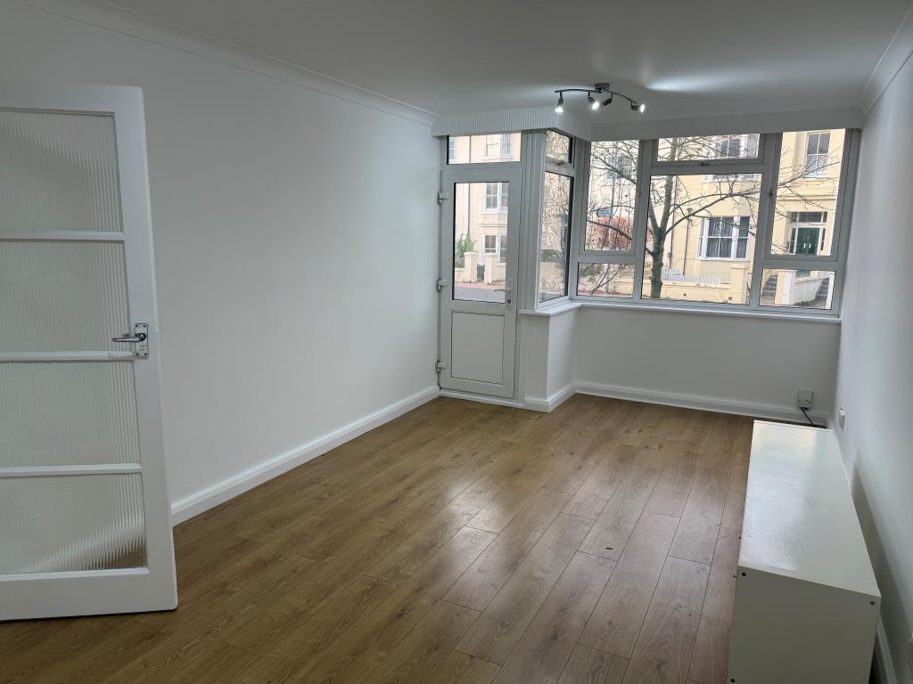 Living room with glazed door to front patio