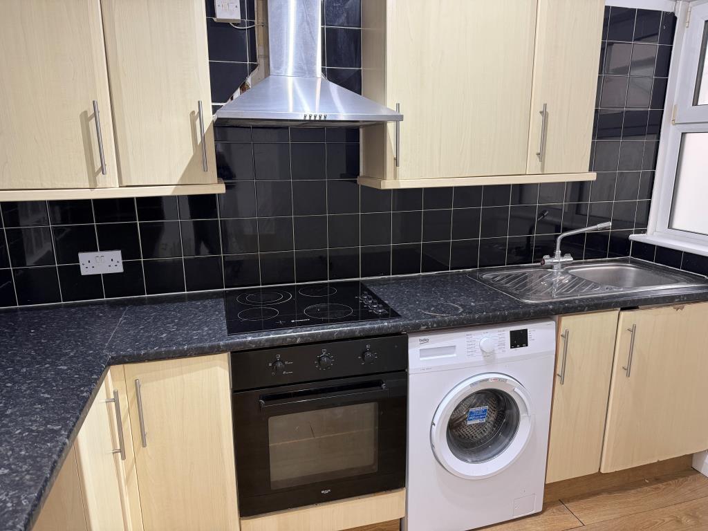 Kitchen with fitted units and internal window