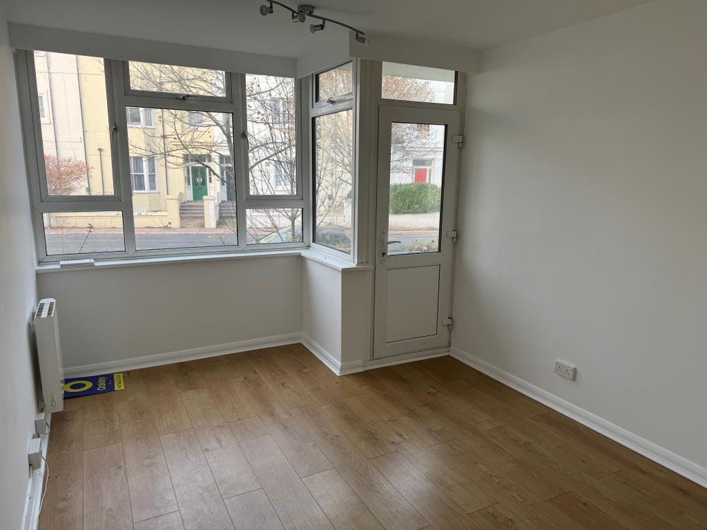 Main bedroom with glazed door to front patio