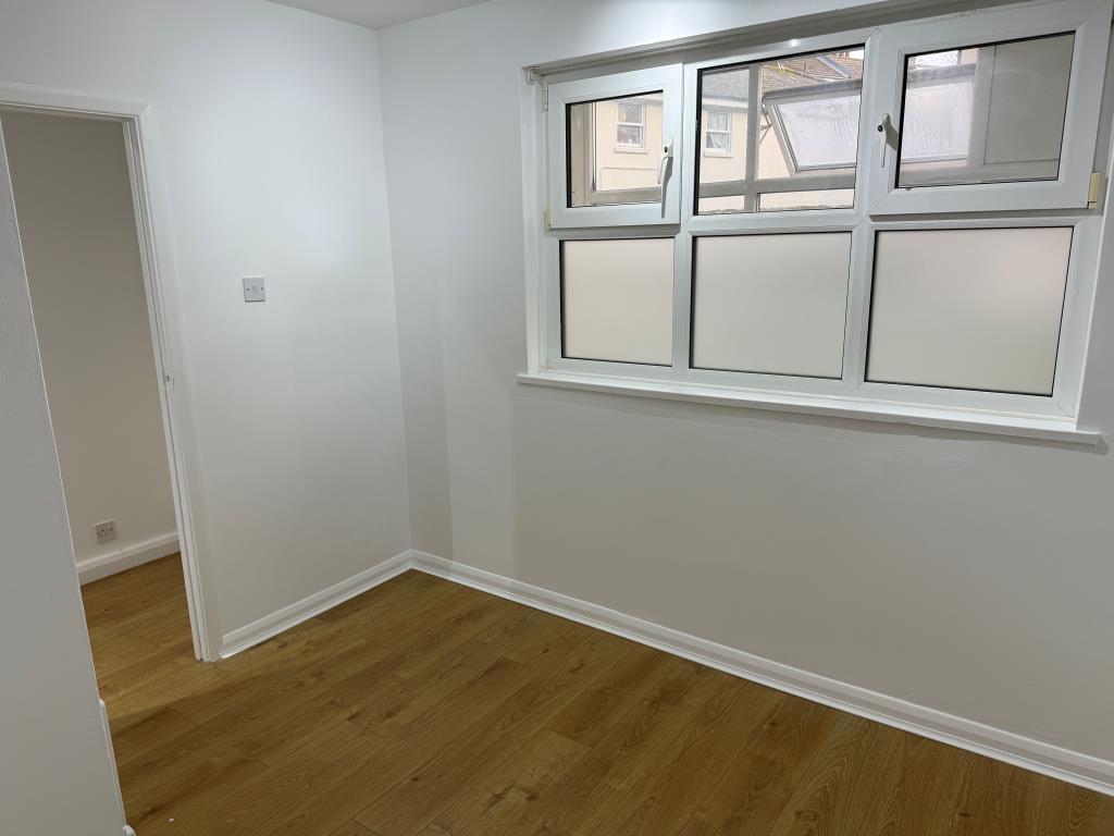 Second bedroom with internal window