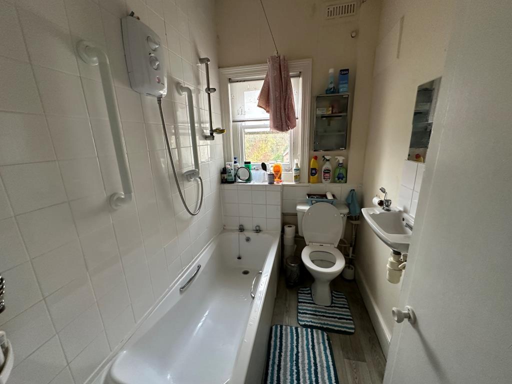 Bathroom with bath, shower, basin and WC