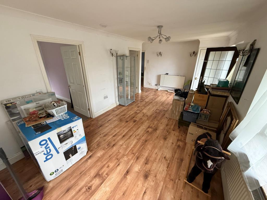 Living room showing access to garden and bedrooms