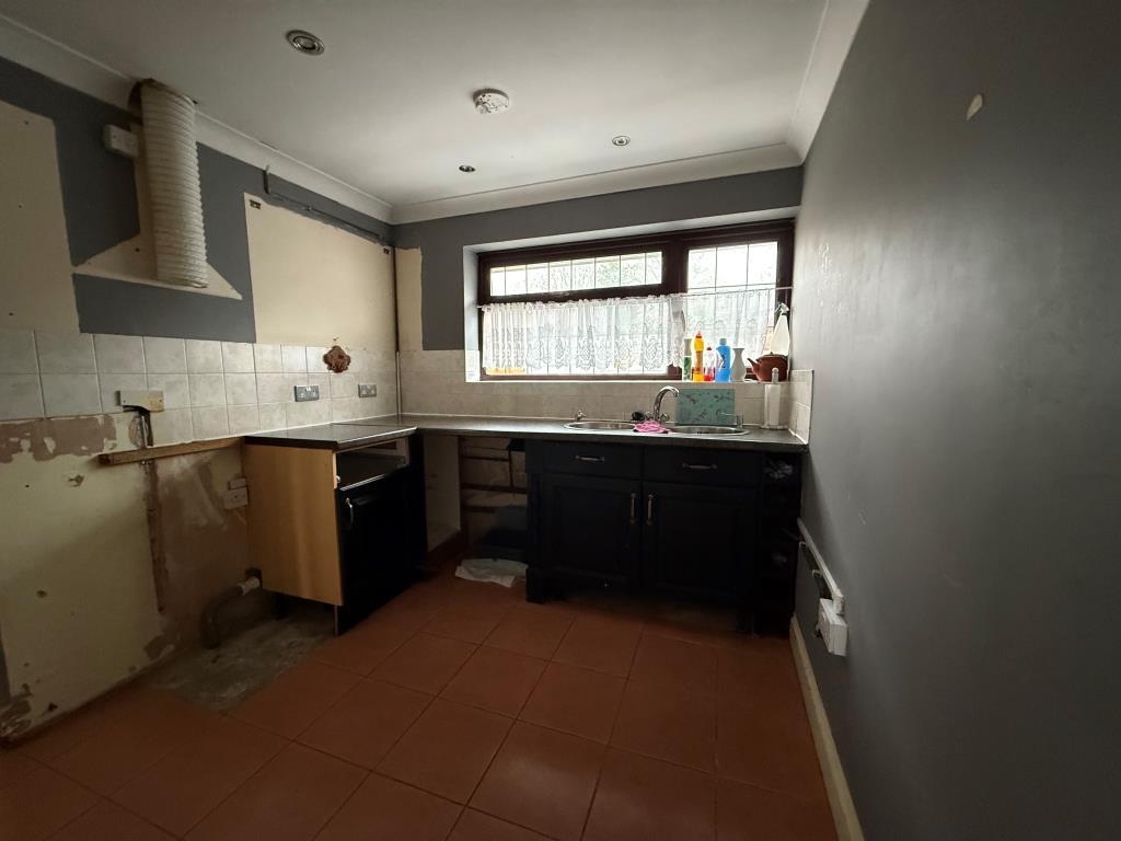 Kitchen containing window and units