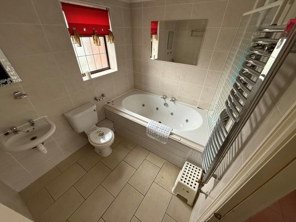 Three piece bathroom with overhead shower