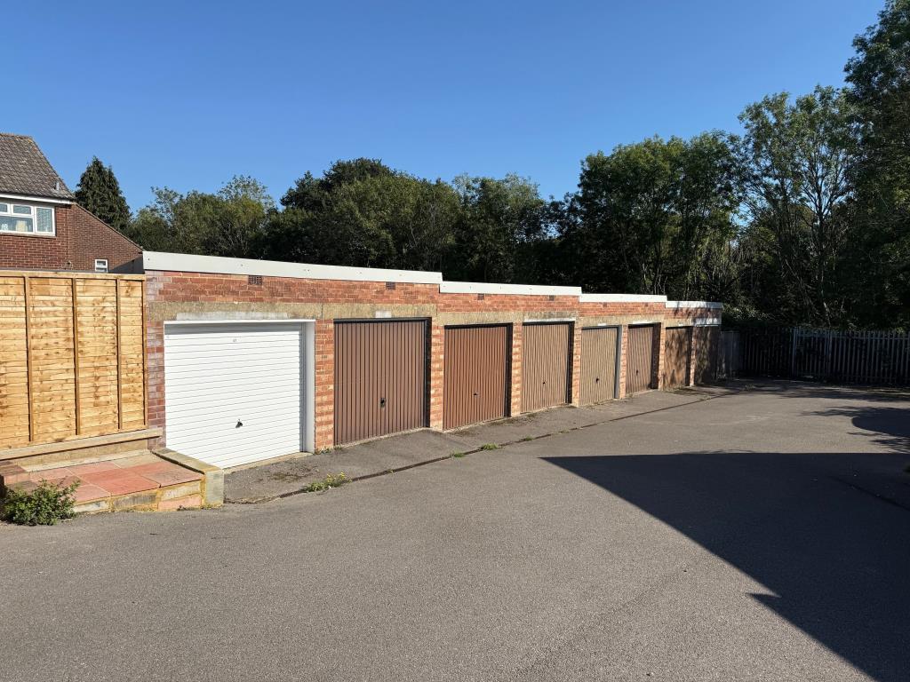 Block of eight garages looking down the hill