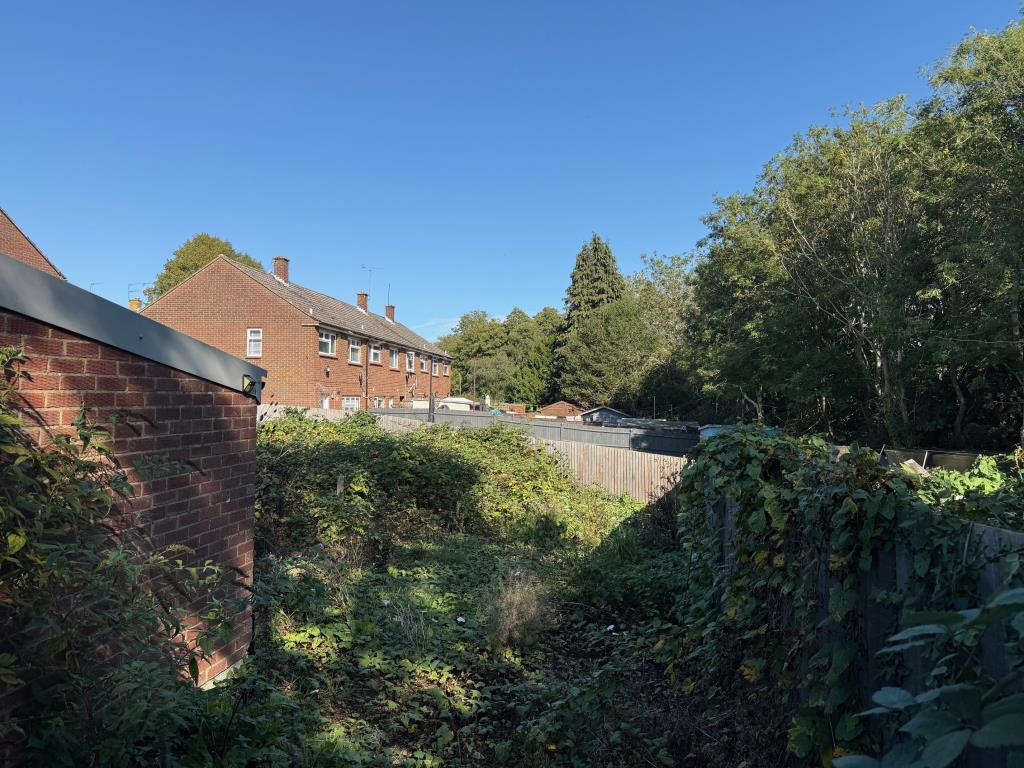 Land to the rear of the garages
