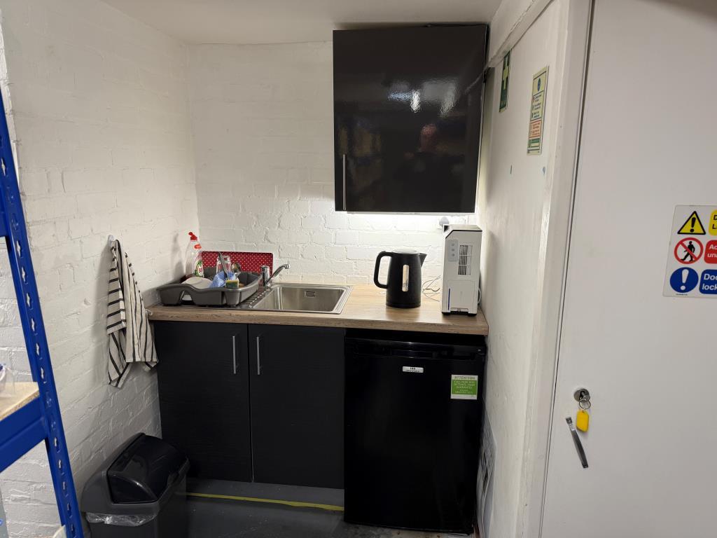 Kitchenette located in basement of commercial unit