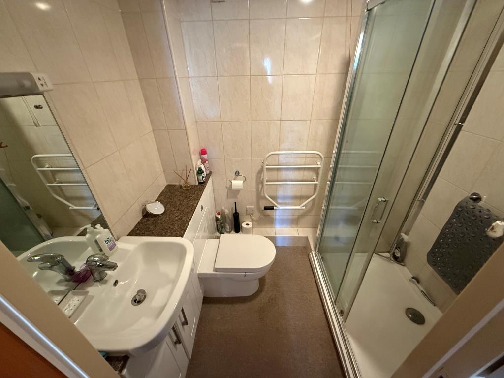 Bathroom with walk in shower sink and toilet
