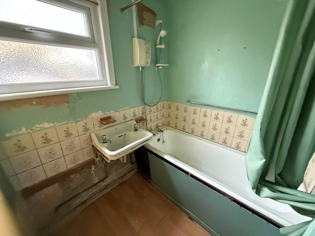 Bathroom with bath sink and separate toilet