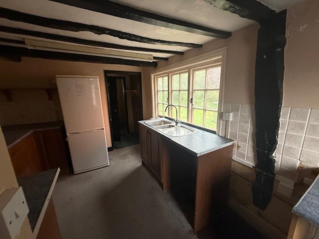 48 Abbey Street kitchen with window and wooden bea