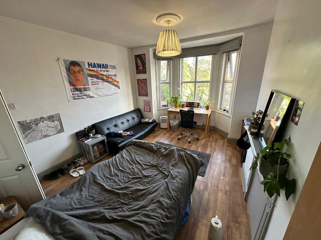 Bright, well-presented bedroom with a large bay...