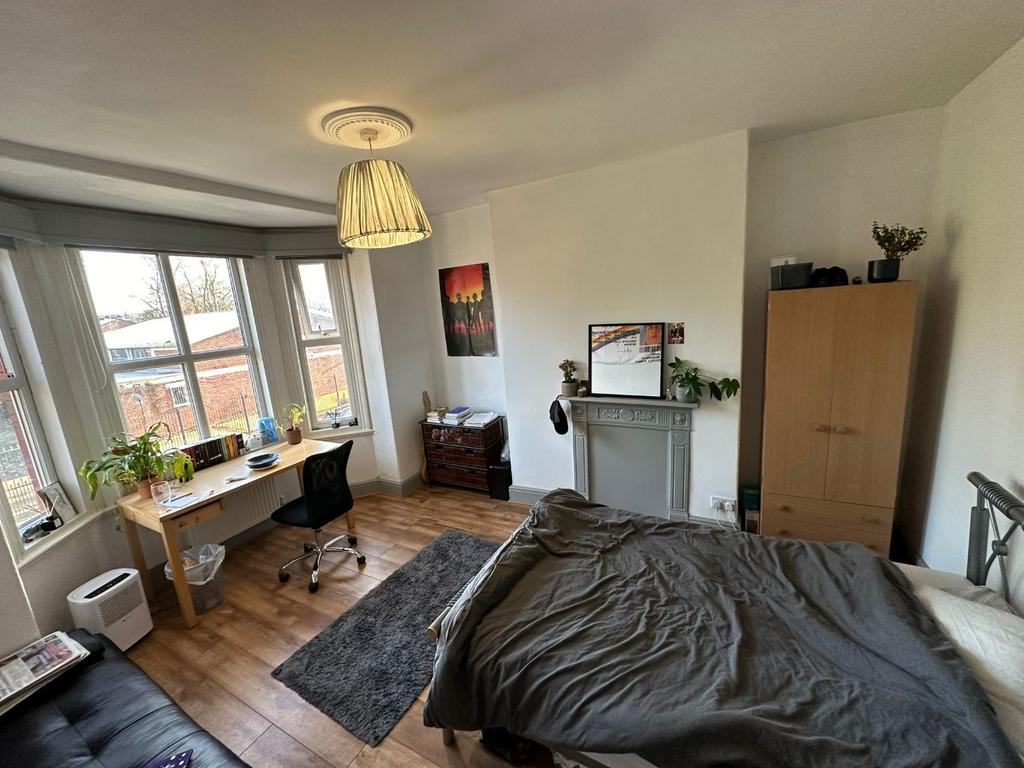 Bright, well-lit double bedroom with a large ba...