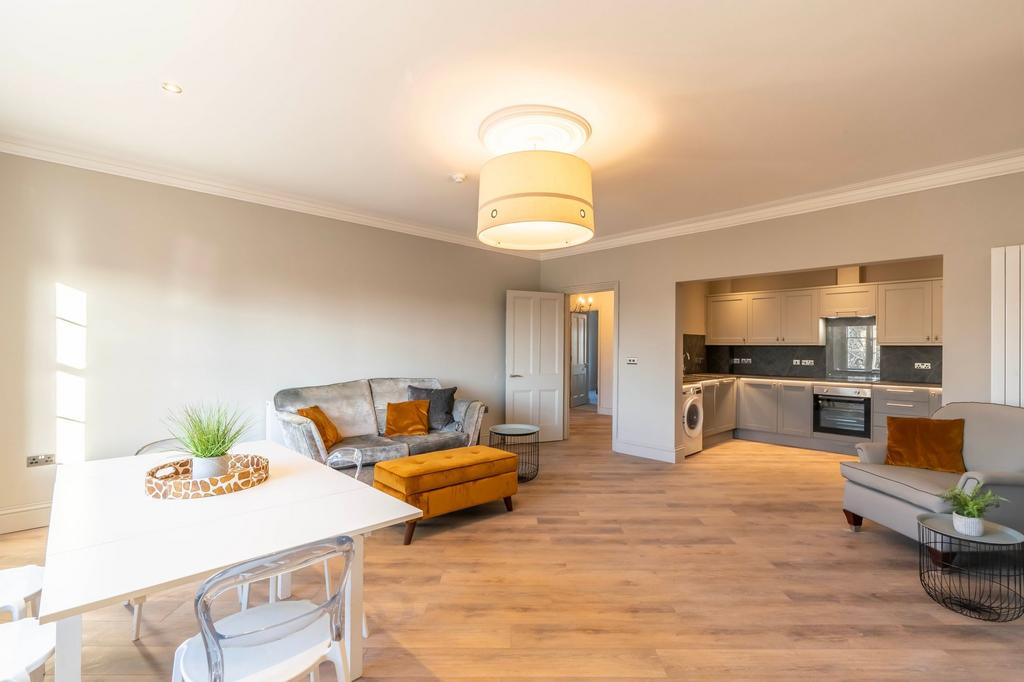 Bright open-plan living area with stylish neutr...