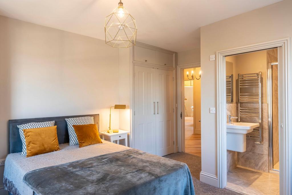 Stylish double bedroom with a comfortable uphol...
