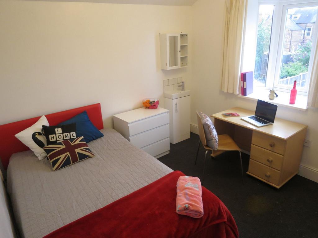 Bright furnished bedroom with a comfortable dou...