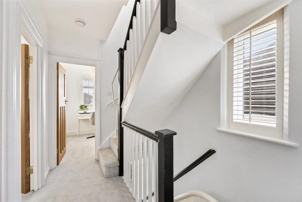 Stairs rising to Second Floor