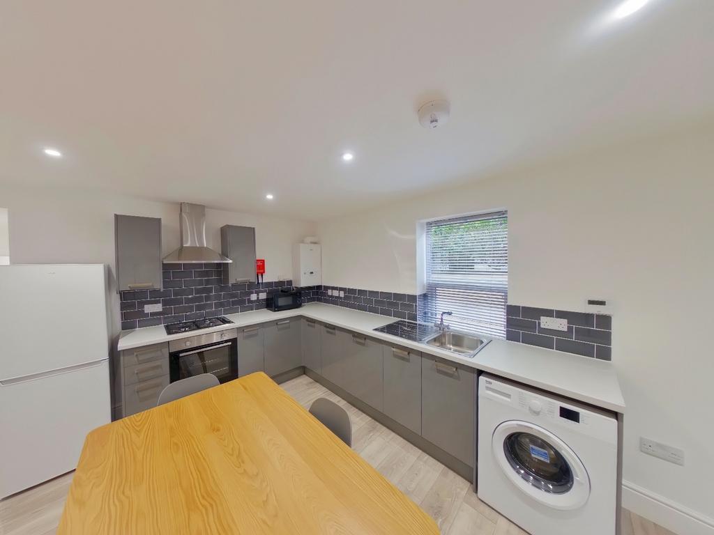 A modern and well-equipped kitchenette, perfect...