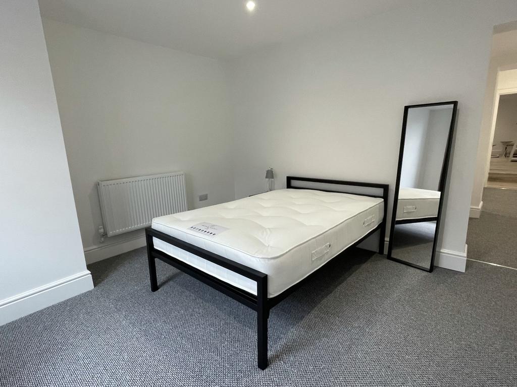 A spacious and inviting double bedroom, perfect...