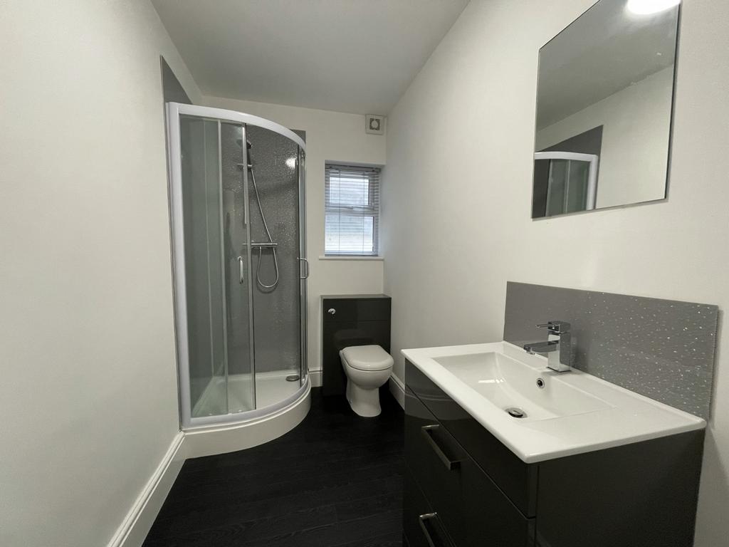 A modern and stylish bathroom featuring a sleek...