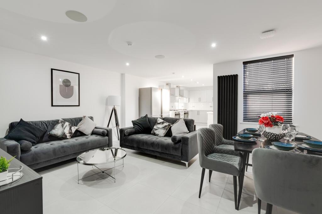 Modern and spacious living room with sleek furn...