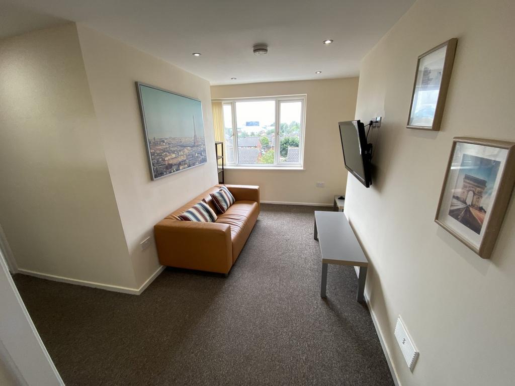 A bright and inviting living room with modern d...