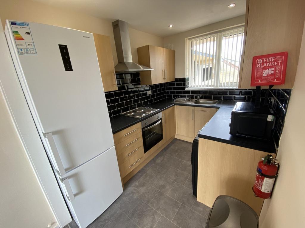 A modern and well-equipped kitchenette with amp...