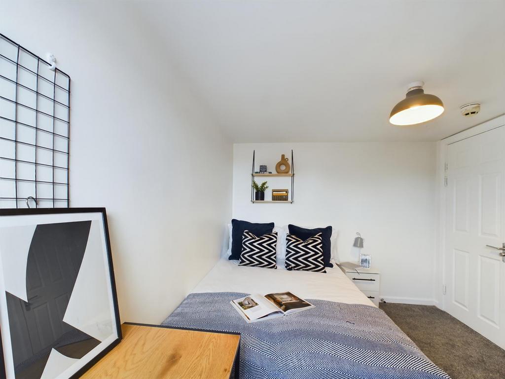 A stylish and inviting double bedroom featuring...