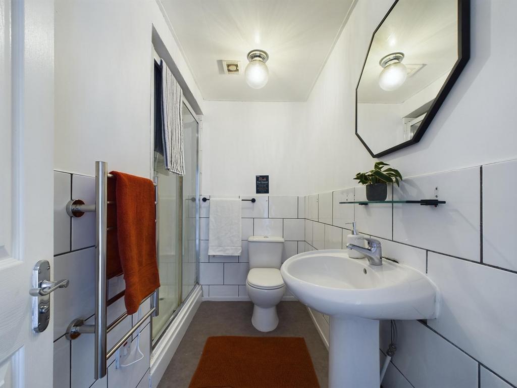 A modern and clean bathroom featuring a shower ...