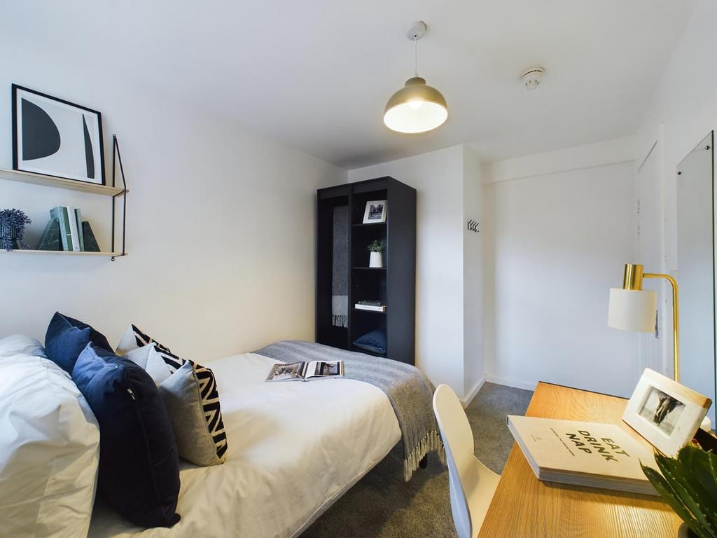A stylish and inviting double bedroom featuring...