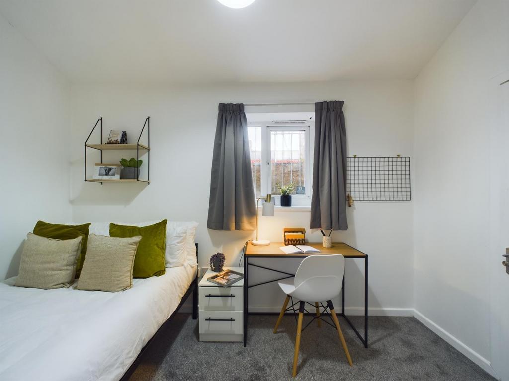 A stylish and inviting double bedroom featuring...