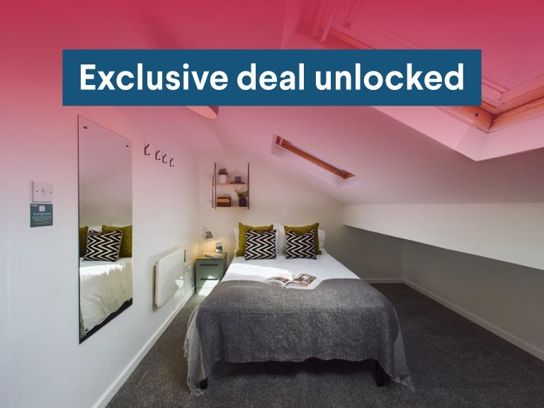 Neat bedroom with a comfortable double bed, con...