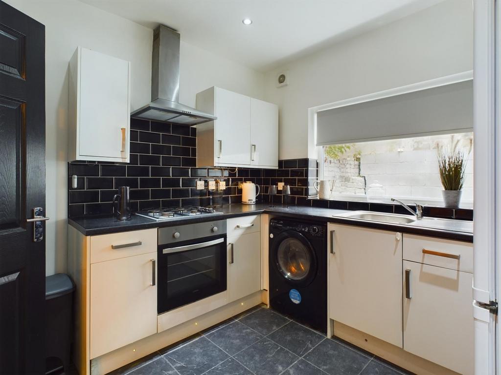 A modern and well-equipped kitchenette featurin...