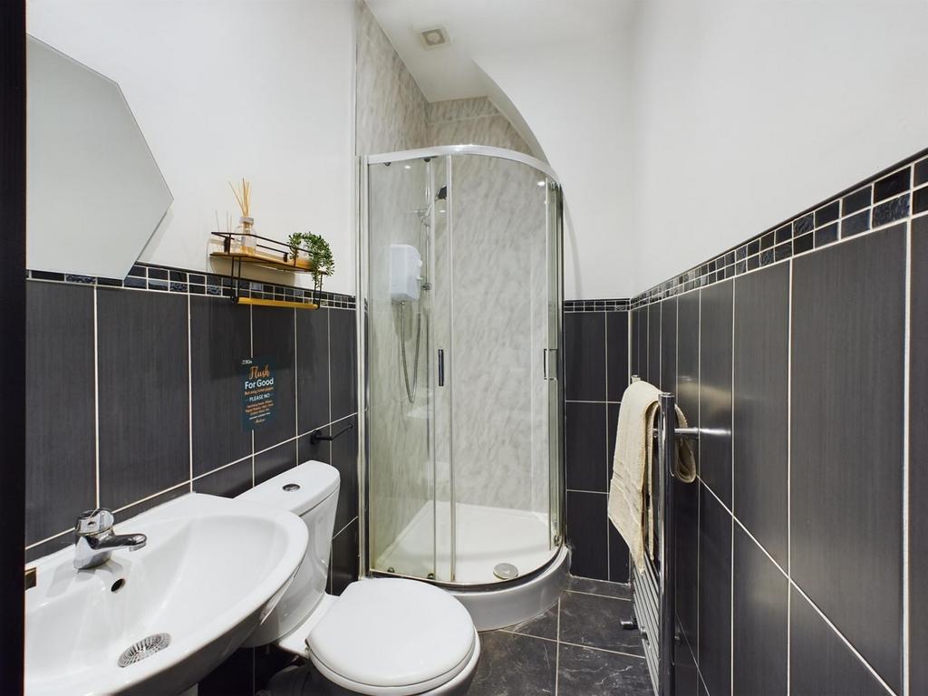 A stylish and modern bathroom featuring a sleek...