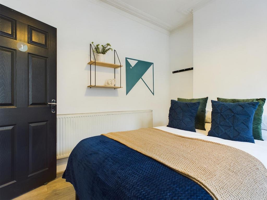 A stylish and inviting double bedroom featuring...