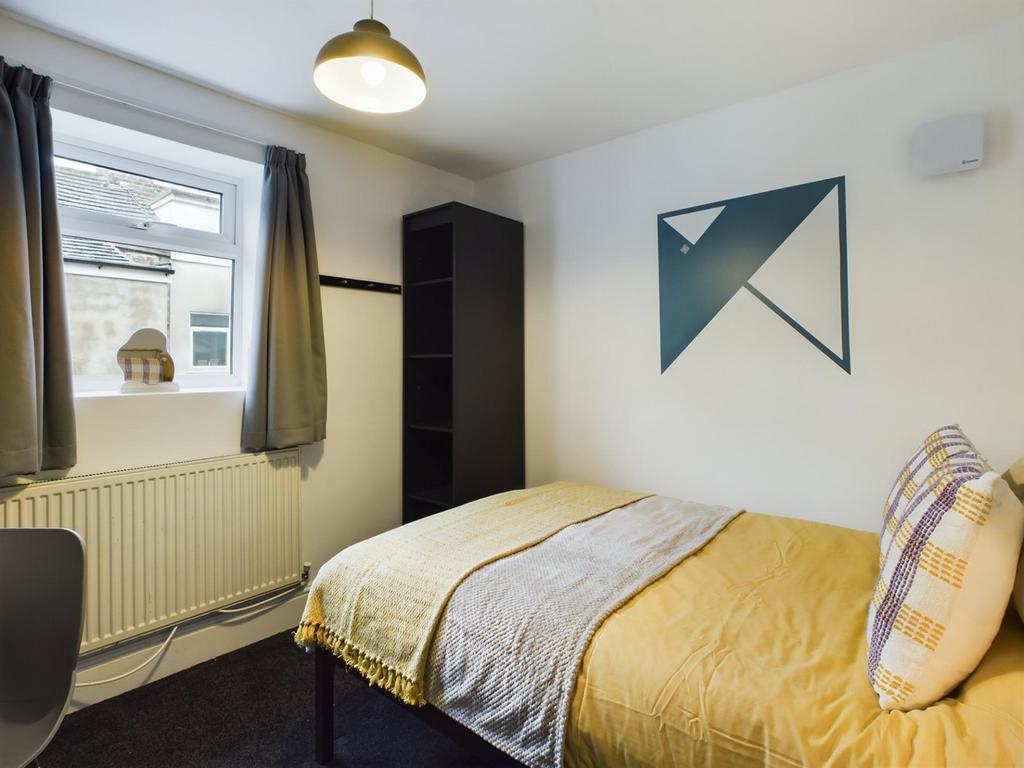 A bright and inviting double bedroom featuring ...