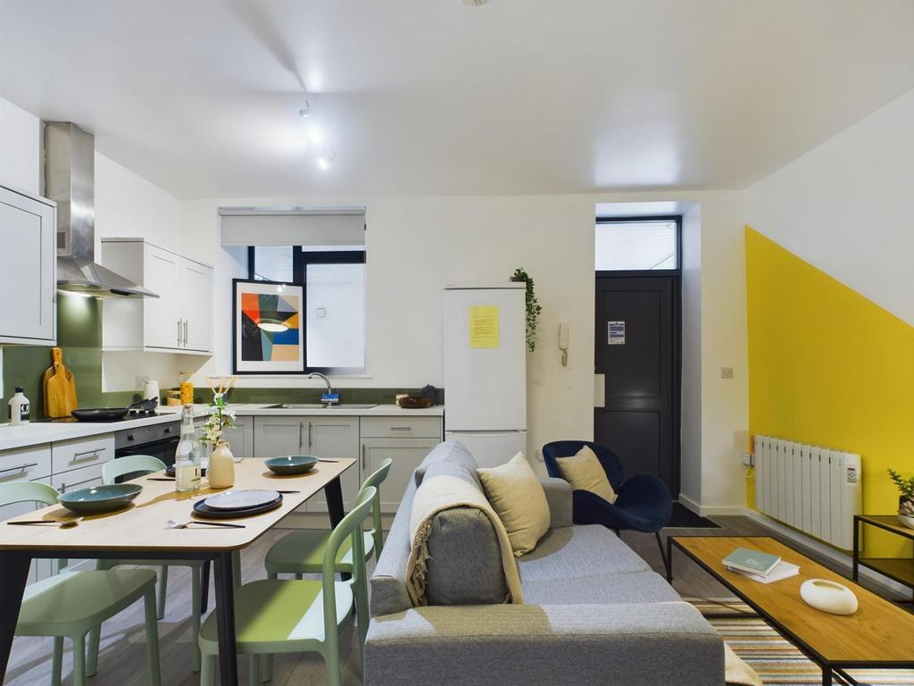 A bright and modern kitchenette with a spacious...