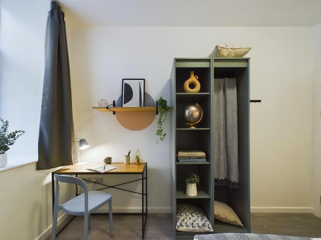 A stylish and well-organized double bedroom fea...