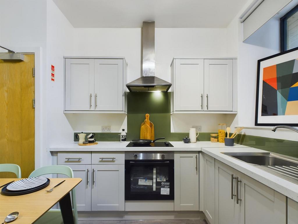 A modern and well-maintained kitchenette featur...
