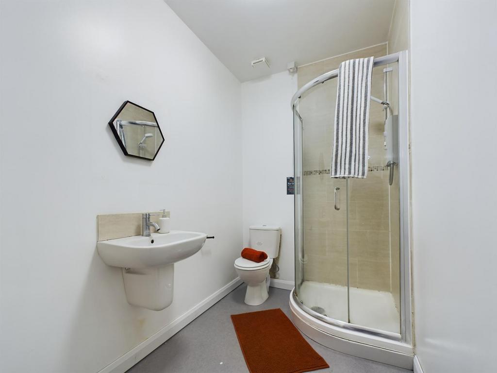 A clean and modern bathroom featuring a stylish...