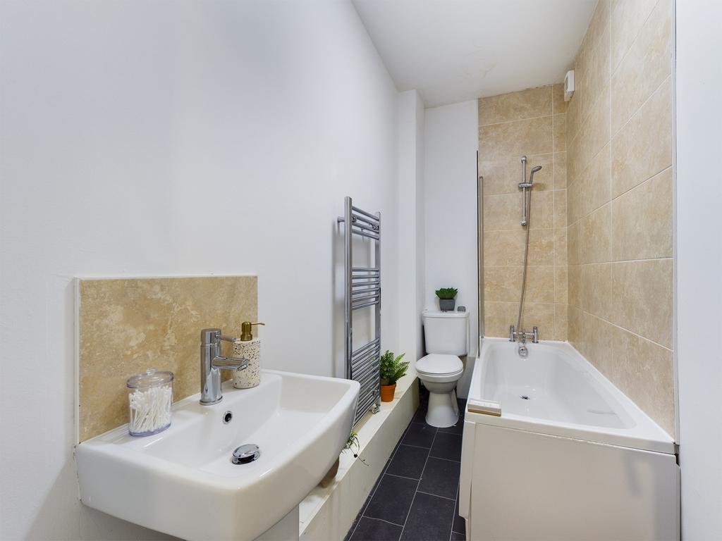 A modern and clean bathroom featuring a stylish...