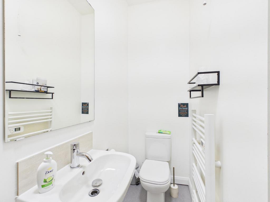 Bright, modern white bathroom with a clean sink...