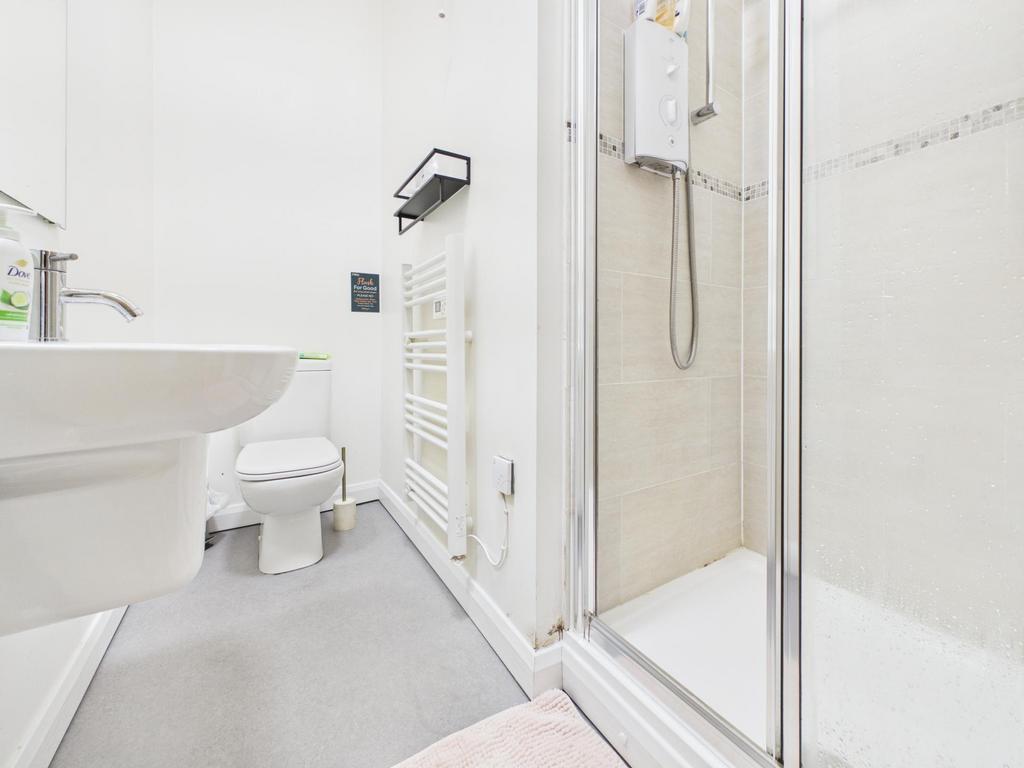 Bright, modern bathroom with a walk-in shower, ...