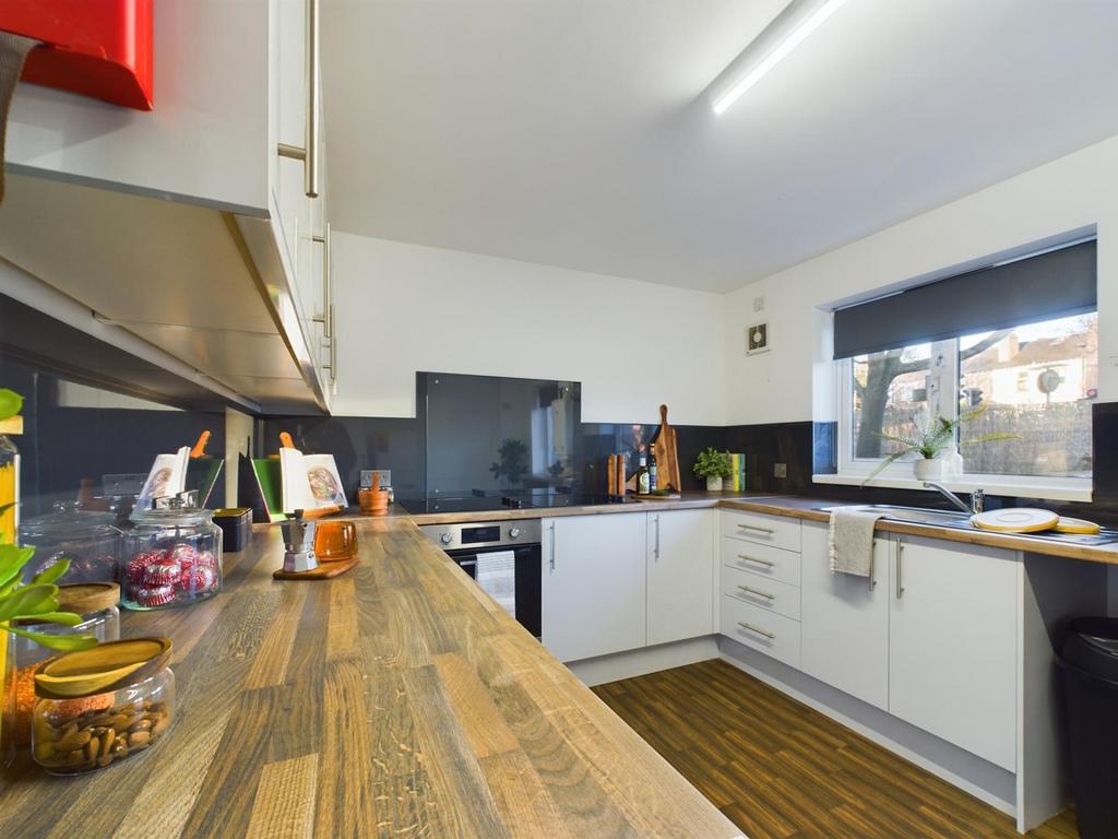 A modern and tidy kitchen with plenty of natura...