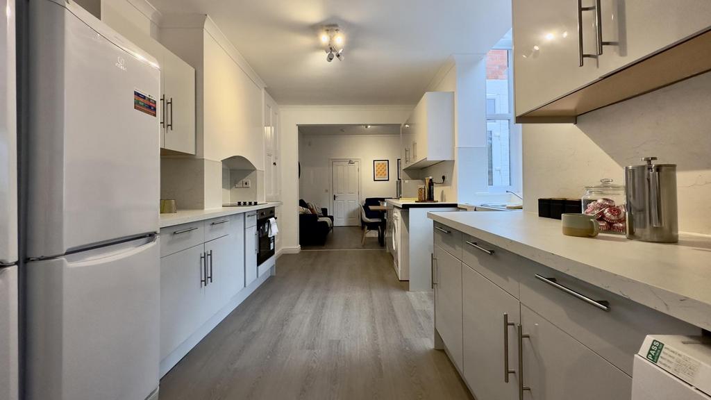 A spacious and modern kitchen with plenty of na...
