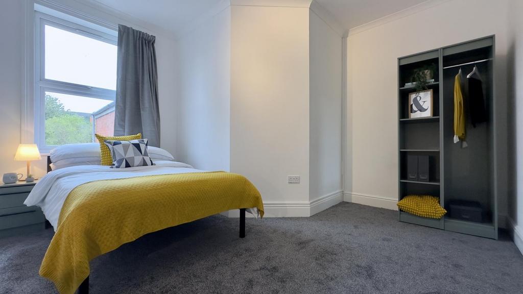 A bright and inviting double bedroom featuring ...