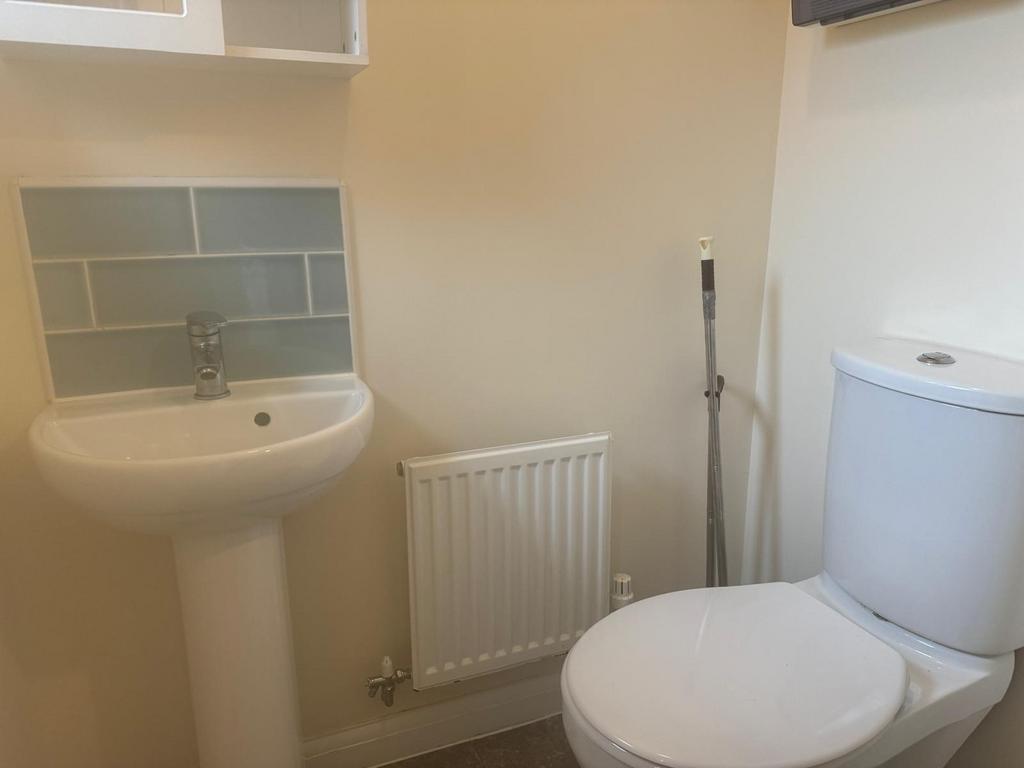 Compact, well-kept bathroom with a modern pedes...