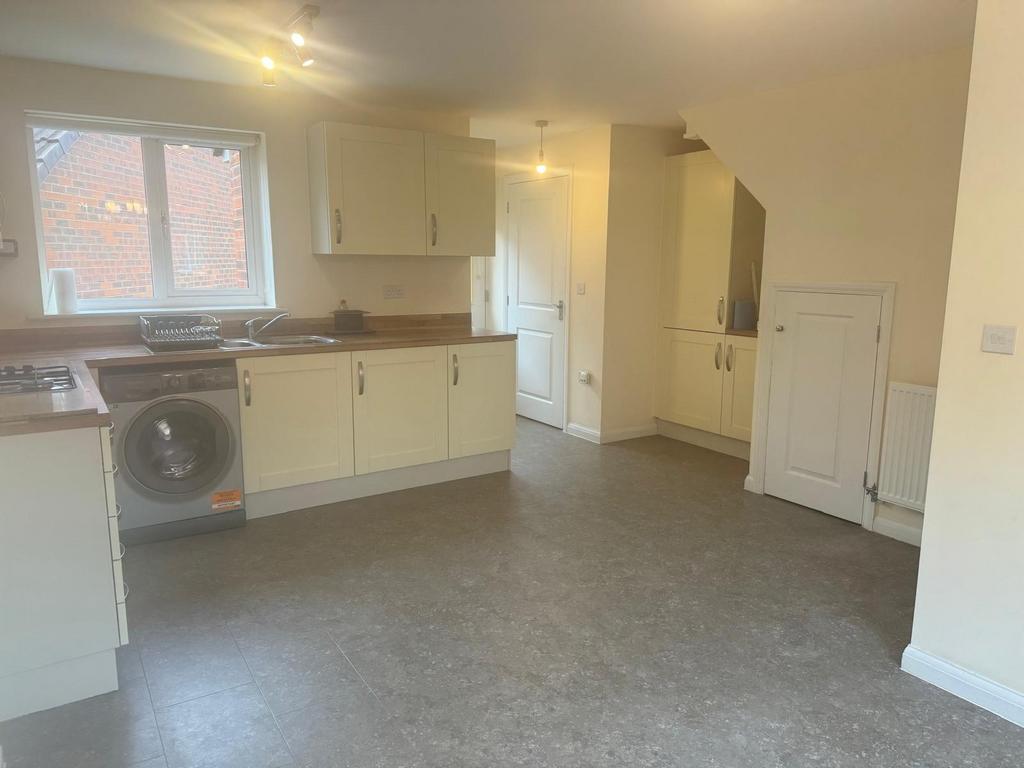 Bright modern kitchen with light-coloured cabin...