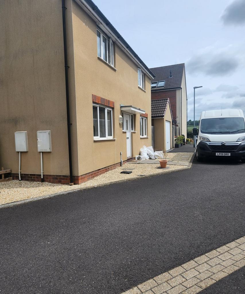 Modern semi-detached house frontage with pebble...